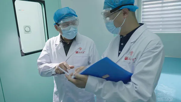 Production staff reviewing manufacturing documentation